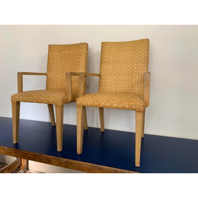 A pair of woven leather Arm chairs in a wonderful camel color. Great as the statement chairs at the head of the table, or...