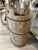 This tall vintage bucket was once a utilitarian staple in rural Asian households, used for carrying water or grain....