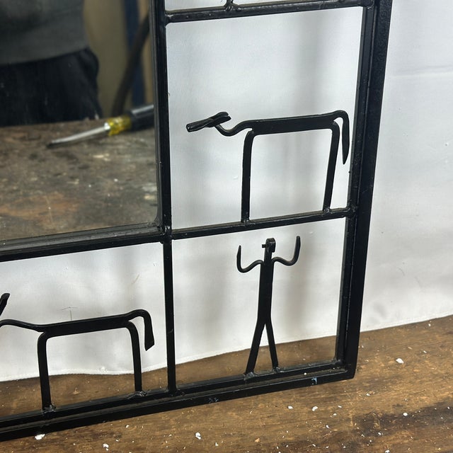 Exceptional Iconic 1950s Frederick Weinberg Style Wrought Iron Brutalist Wall Mirror The interior mirror is framed by 14...