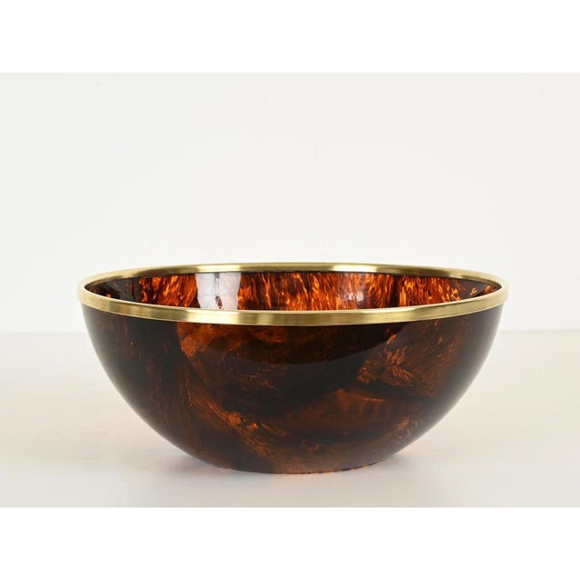 Marvelous and unique oversized bowl or centerpiece in splendid tortoiseshell-effect acrylic glass and brass. This...