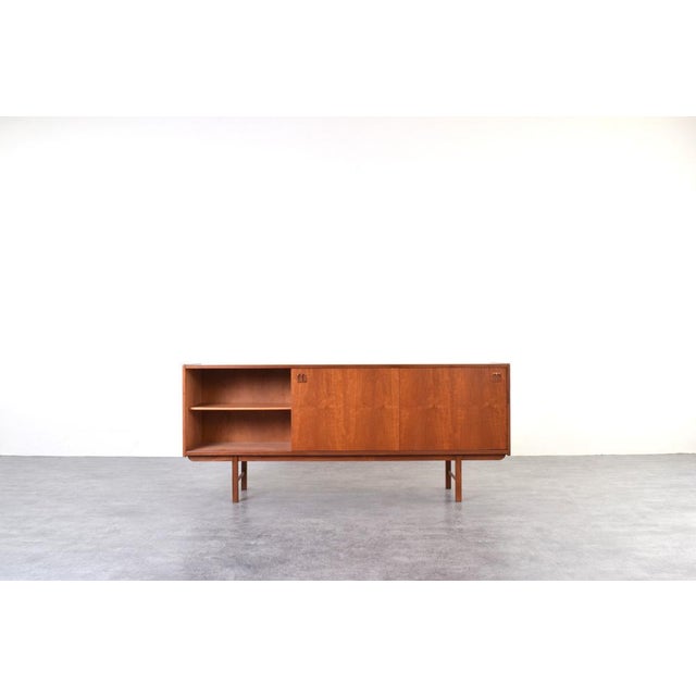 This teak sideboard was designed in the 1960s by Klippan Korsør and manufactured by IKEA. This sideboard has been...