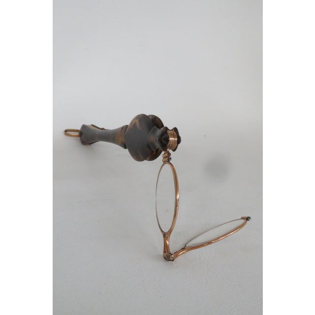 This lovely Lorgnette Opera Glasses are made out of metal, and faux tortoise. It was made in the late 1800s and it has a...