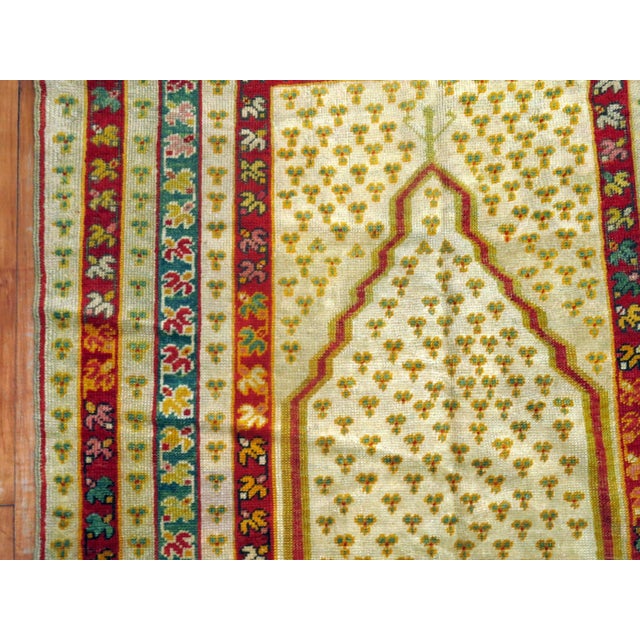 Early 20th century colorful ivory field Turkish ghiordes prayer rug. rug no. 28784 size 3' 8" x 5' 4" (112 x 163 cm)