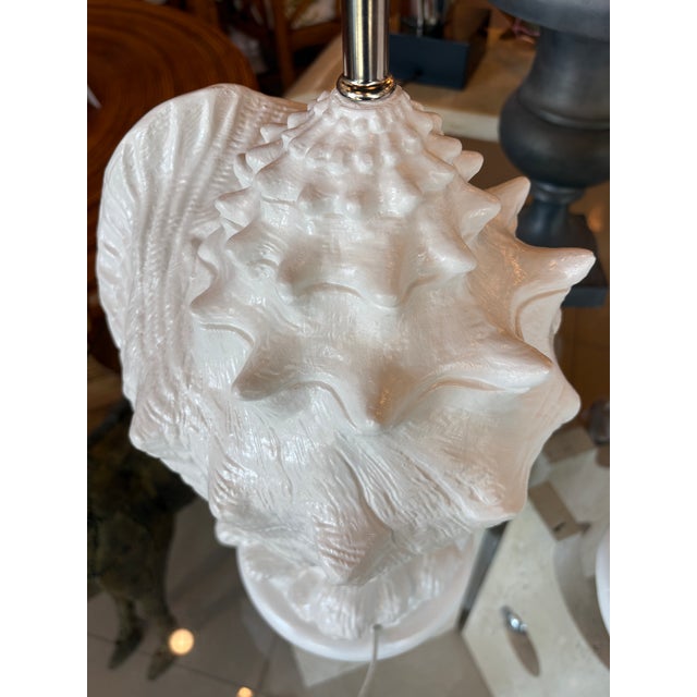 Vintage pair of white lacquered plaster conch shell seashell table lamps. These have been newly restored. Newly rewired,...