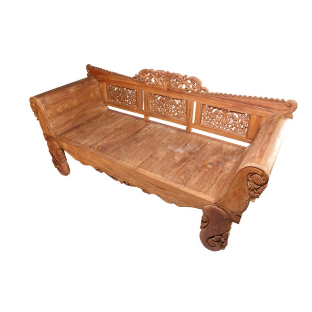 Hand carved back combined with the natural rustic patina of the teak wood, this daybed is a nice mix of handsome Balinese...