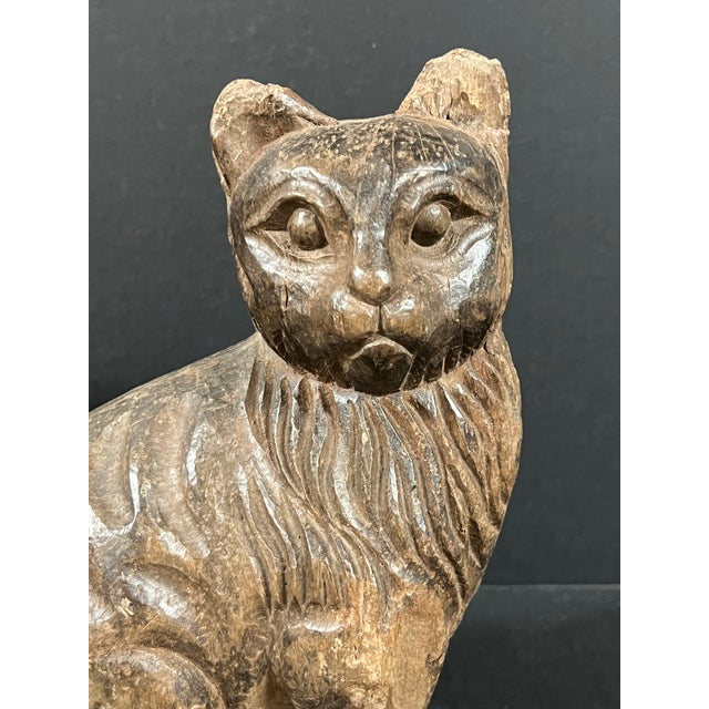 ITEM NAME: Folk Art Carved Wooden Cat Sculpture ORIGIN: Philippines AGES: Late 20th Century MATERIALS: Wood MEASUREMENT:...