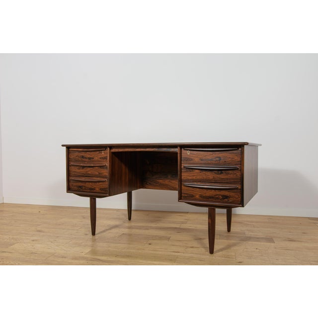 This elegant freestanding desk was designed by Svend Åge Madsen for the Danish furniture manufacturer Falster Møbelfabrik...