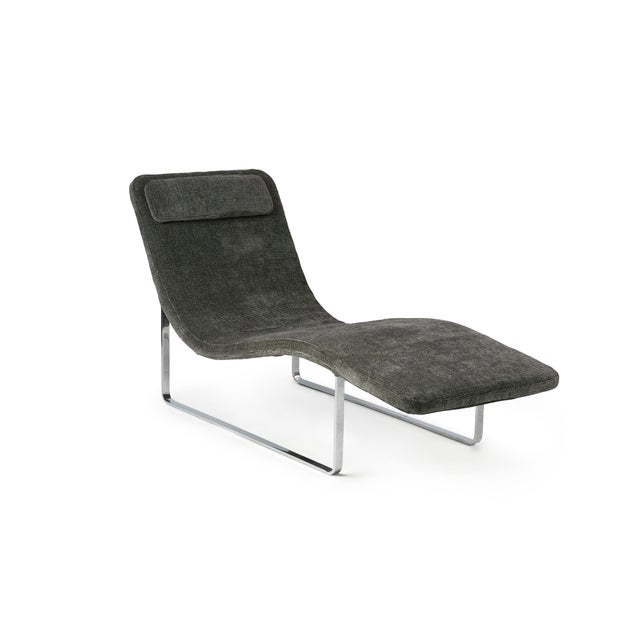 This sleek contemporary chaise lounge by B&B Italia, designed for the American market. Featuring a sculptural, gently...