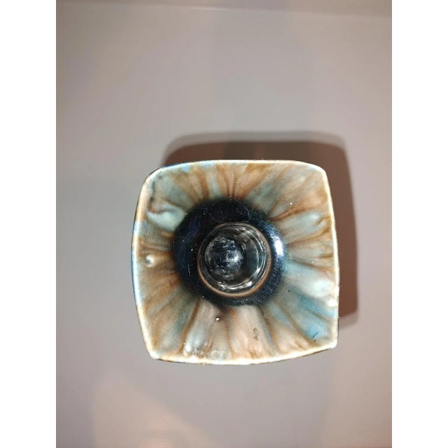 Vintage Boho Large Artisan Candlestick Holder exhibits a melding of neutral olives, blues and brown charcoals with cream...