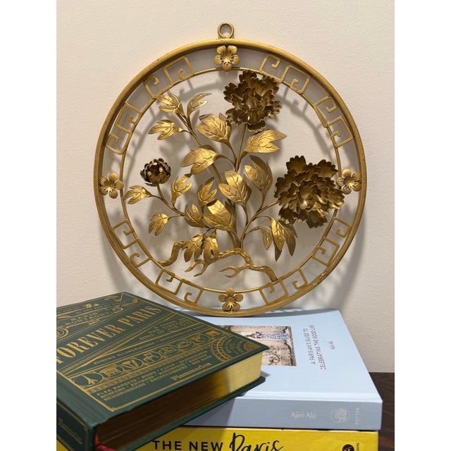 This vintage Hollywood Regency style gold metal wall art features traditional Asian inspired 3-dimensional floral branches...