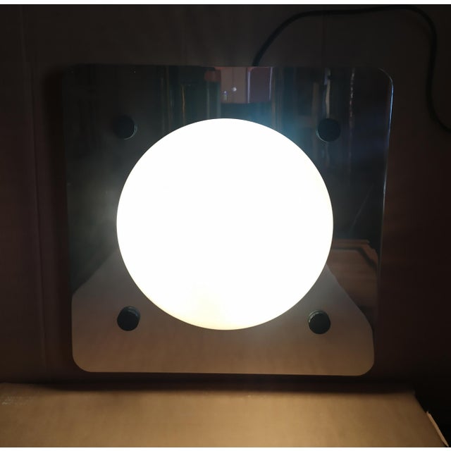 This wall lamp is attributed to Lamperti of Robbiate/Milan, due to its shape and style. It lacks any trademarks or labels....