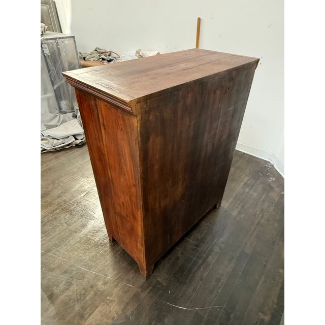 Design Plus Gallery presents a Vintage Carved Wood Cabinet. The rectangular case is framed by molded trim along the top...