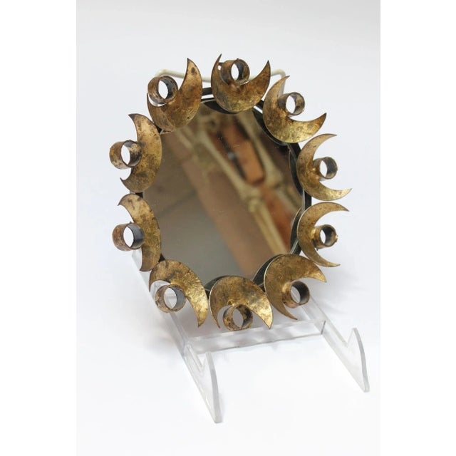 Unique vintage mirror with a gilded mixed-metal border composed of half-moon decoration welded to cylindrical rings (ca....