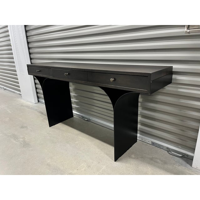 Sleek sophisticated mixed media modern desk handcrafted of minimalist finished metal , curved legs and walnut drawers....