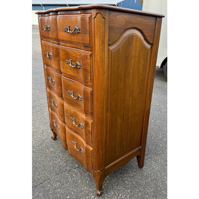 Elegant vintage French Provincial highboy dresser featuring beautifully curved serpentine drawers, cabriole legs, and...
