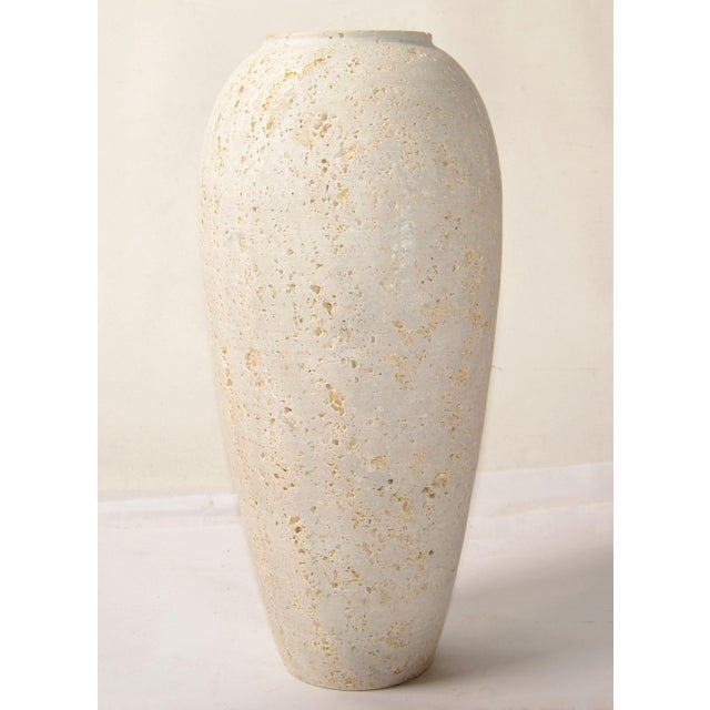 The Italian Classic Riven Travertine Venice Cone Vase attributed to Fratelli Manelli for Raymor is a versatile element...