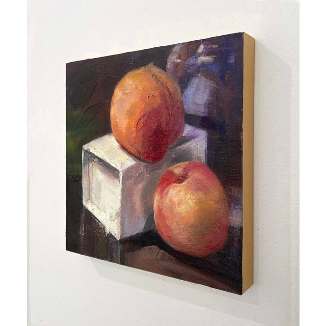 Realism Two Peaches by Yana Beylinson | Oil on Board Still life of two peaches on a white box. For Sale - Image 3 of 3