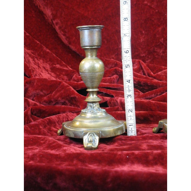 This exquisite pair of antique brass candleholders is a true Victorian gem. The intricate design and attention to detail...