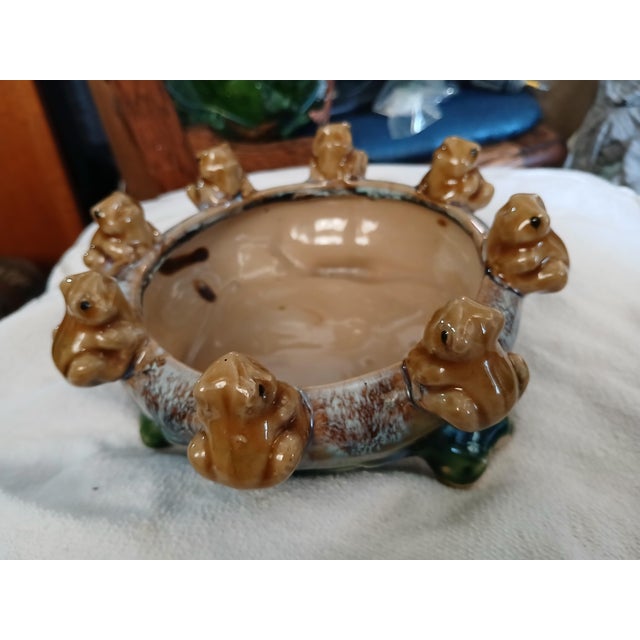 This 8 frog ceramic drip glaze planter or cache pot is attributed to California Pottery. Blues greens Browns and golds...