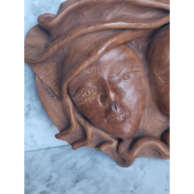 This exquisite double faced leather mask was sculpted in Siena Italy in the late 1990s. The two women have expressions...