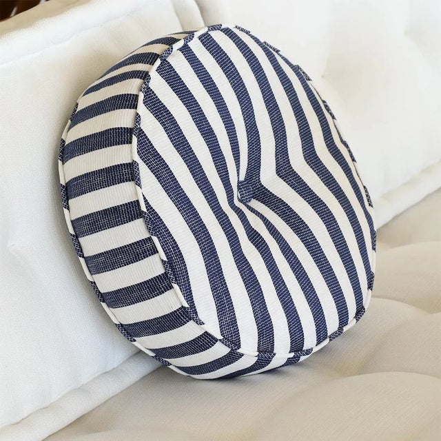 Blue stripe circle pillow made from vintage cotton fabric with piping and center button detailing. Measures 14" Diameter x...