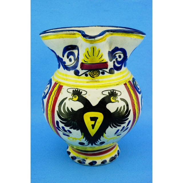 MEASUREMENTS: Height: 19 cm; Width: 17.5 cm; Depth: 15 cm; Weight: 0.820 kg Item : A fine high-fired glazed ceramic jug...