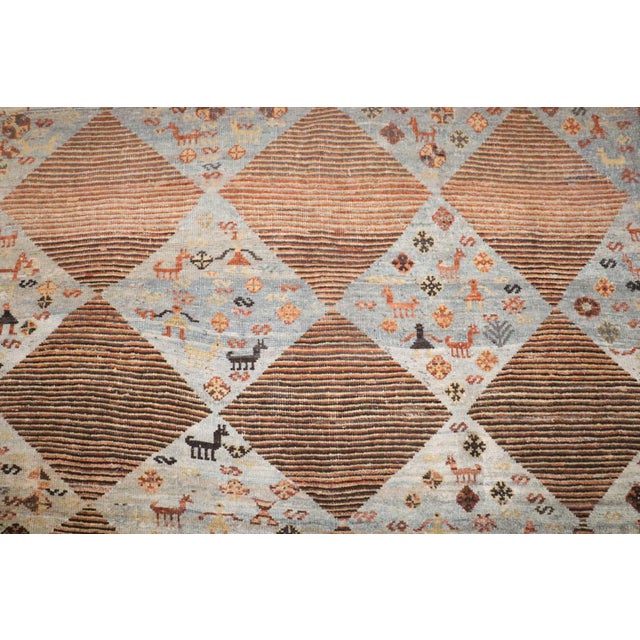 an intermediate size Persian Gabbeh rug made in the middle of the 20th century