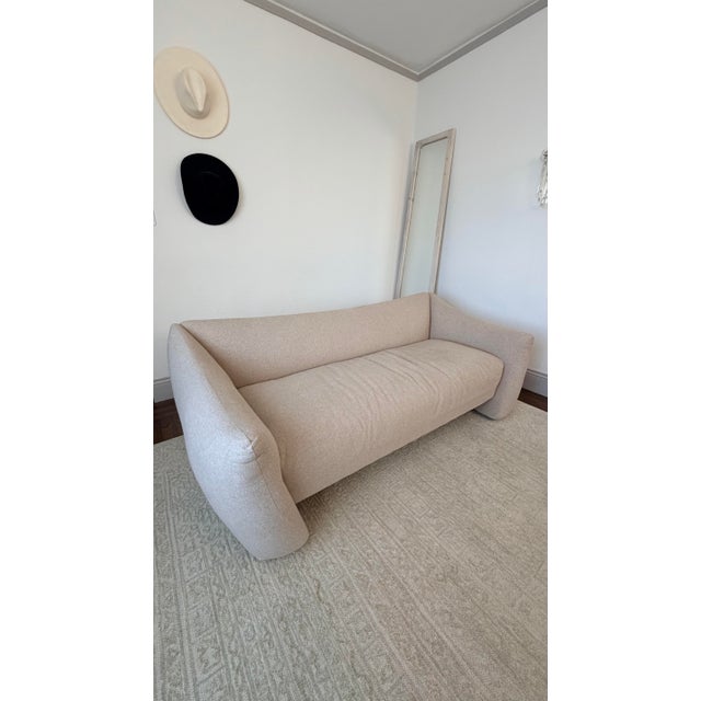 Informed by the curvaceous shapes of postmodernist design, the Bond Settee features a flared silhouette with all-around...