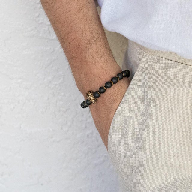 Onyx Stone King Skull Men's Beaded Bracelet is perfect for strong, confident men. This handmade bracelet is simple yet...