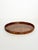 An elegant wooden serving tray featuring stunning burl wood veneer; the rich, nuanced grain patterns create a particularly...