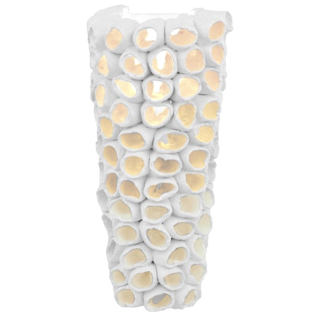 Designed by Lorenzo Zanovello, the Reef Cone Sconce pairs sculpted ceramic geometry with dramatic illumination....