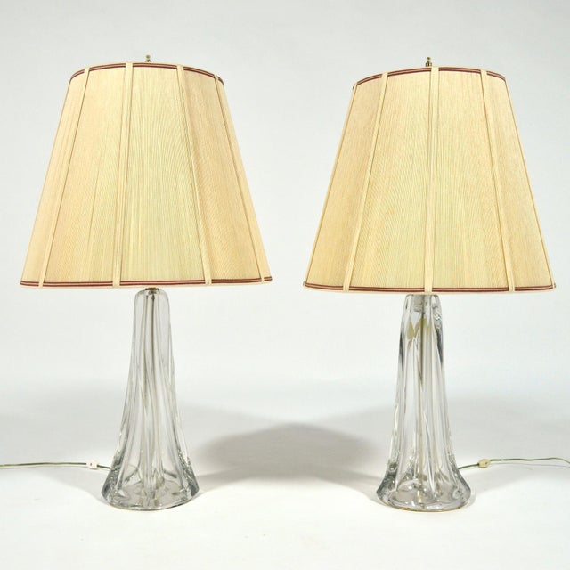 This extraordinarily beautiful pair of large crystal table lamps are unmarked, but are very similar to works by Val Saint...