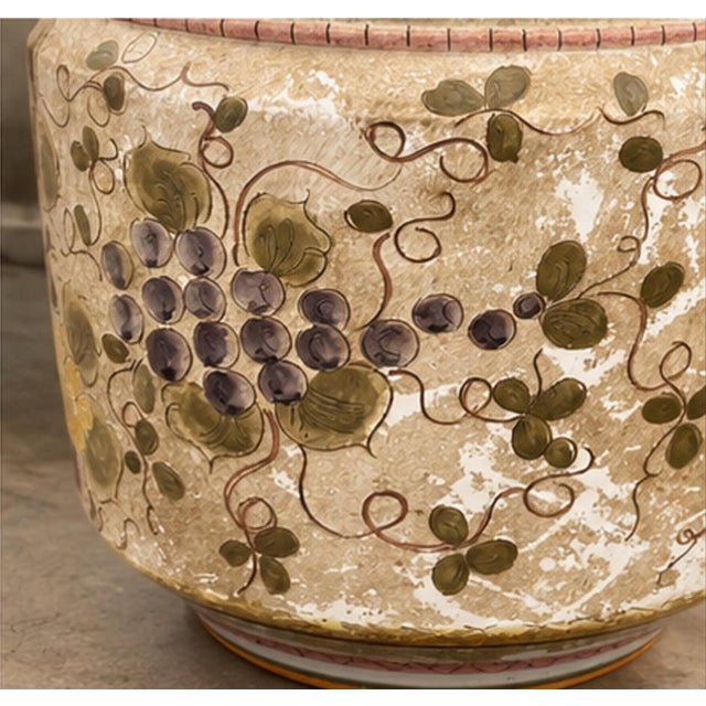 Large handcrafted ceramic jardinière made and hand-painted in Italy in 2003. The rounded vessel is richly decorated with...