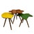 A set of three original side tables, crafted from brightly colored glass and natural-finished wooden legs. Each table...