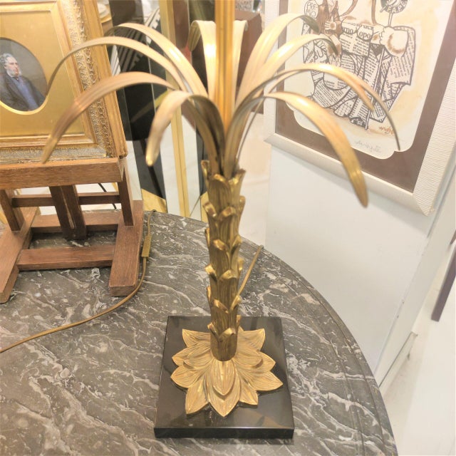 Maison Jansen lamp, original from the 1970s. Original metal shade. Stylized palm tree shape with a square black marble...