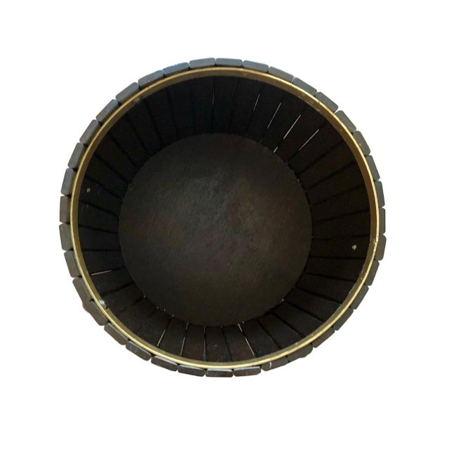 A dark wood pedestal planter stand or sewing basket by high end Japanese furniture maker Karimoku! This rare find is...