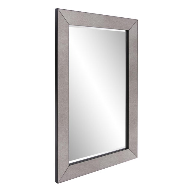 A rich smokey antique mirror covers the outer frame of this simply elegant, beveled mirror. Whether its preparing for the...