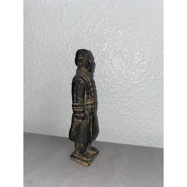 Small terra cotta Chinese warrior figure. The dimensions are: 6.25"" high 2.25"" wide 1.25"" deep If you are pressed for...