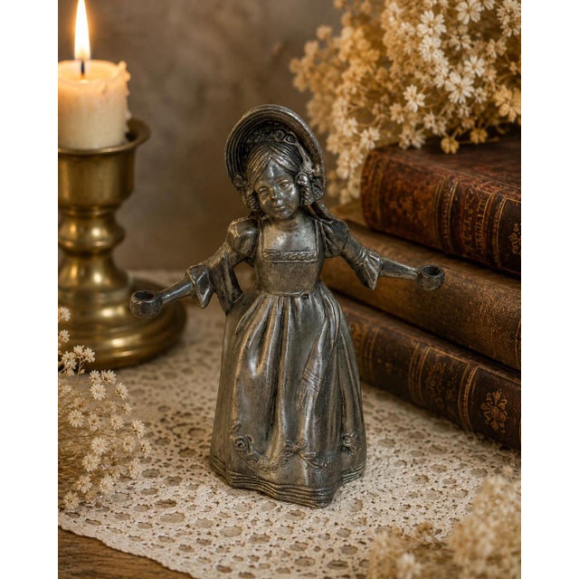 Antique pewter figural candle snuffer depicting a young bonneted girl traditionally associated with Hans Christian...