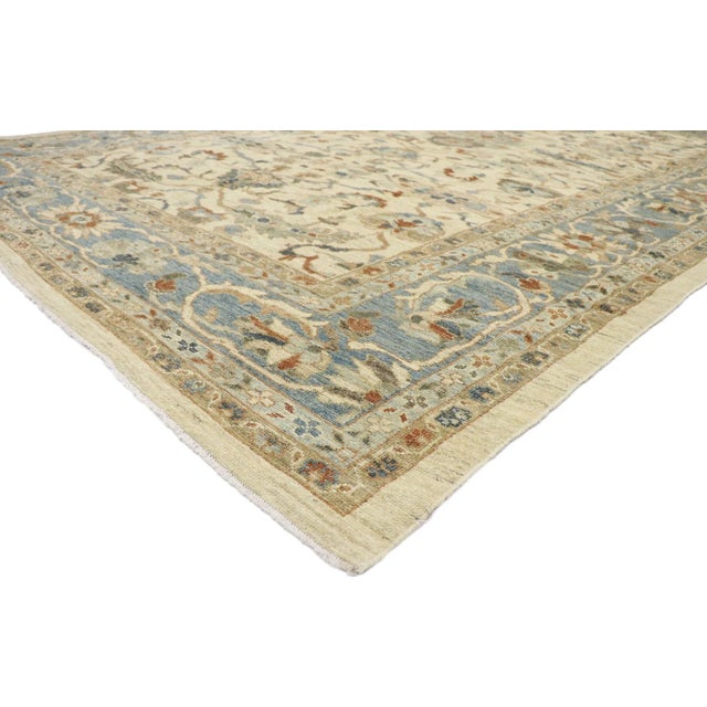 60915 Persian Sultanabad Rug 10'00 x 14'03. This hand-knotted wool Persian Sultanabad rug features an all-over botanical...