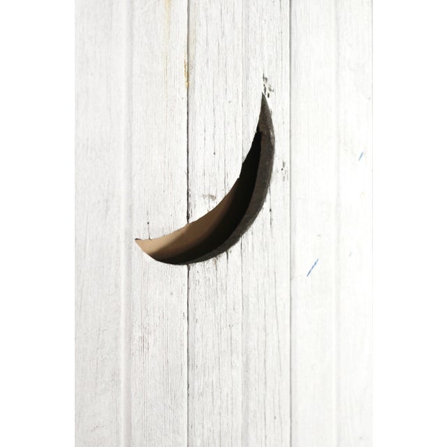 A rustic farmhouse or outhouse door complete with crescent moon cutout window. Rustic white paint with patina and...