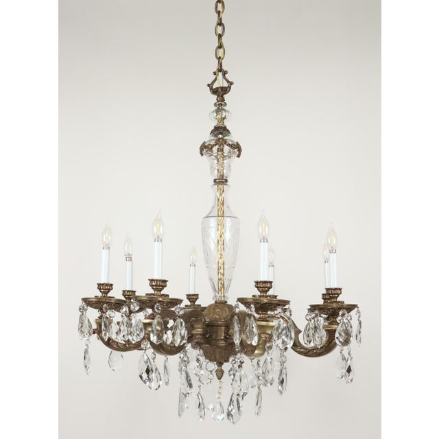 1930s Victorian style eight arm chandelier made of faceted teardrop crystals and an etched central crystal stem with an...