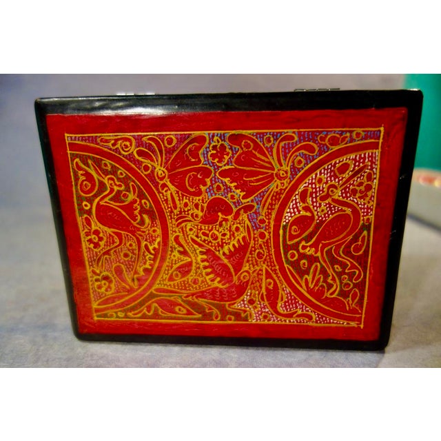 Quintessential folk art in warm red, this hand- crafted hinged box is made in the southern part of Mexico in the state of...