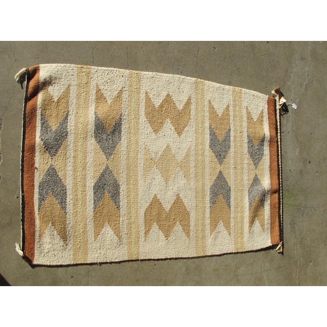 Vintage, mid century Navajo SW Native American rug. Woven wool in earth tones with a Chevron design. Attached to pole, but...