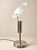 A sculptural table lamp, believed to be french and dating from the 1990s, distinguished by its striking combination of...
