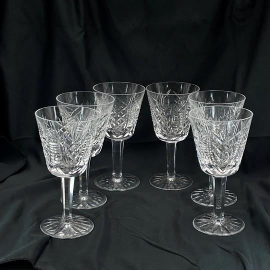 Set of six sparkling claret wine glasses in the “Clare” pattern by Waterford Crystal. The pattern was introduced in the...