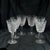 Set of six sparkling claret wine glasses in the “Clare” pattern by Waterford Crystal. The pattern was introduced in the...
