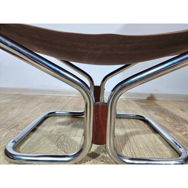 The iconic Wing armchair with footstool by Harald Relling for the Norwegian manufacturer Westnofa is a timeless classic of...