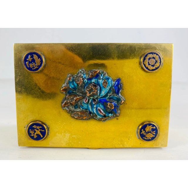 This is a vintage Chinese solid brass and enamel trinket box. This solid brass box has four medallions to the top and...