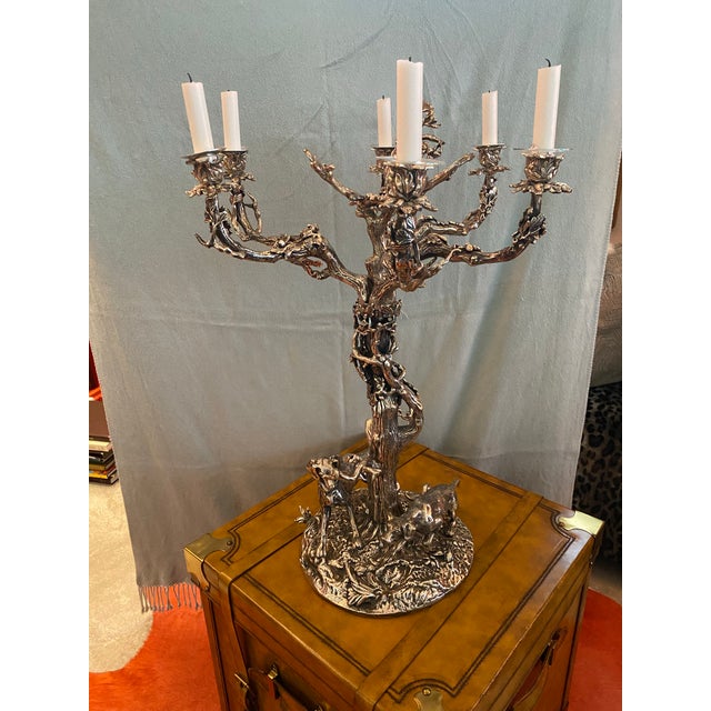 Large silver plated candelabra with six leafy branches on a twisted tree trunk shaft. Inspired by the style of vintage...